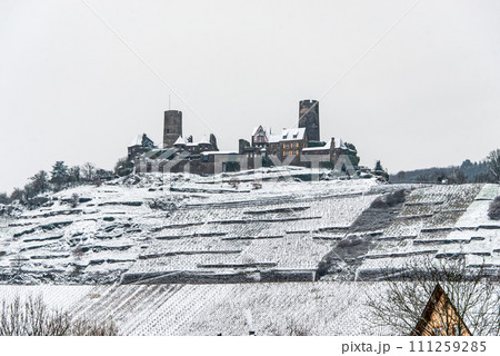 Winter at Burg Thurant Castle at the Mosel vineyards nestled in the hills above the Moselle River Germany Town Alken Winter at Burg Thurant Castle at the Mosel vineyards nestled in the hills above the Moselle River Germany Town Alken 111259285