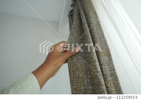 close up of holding a clean fabric curtain. 111259553