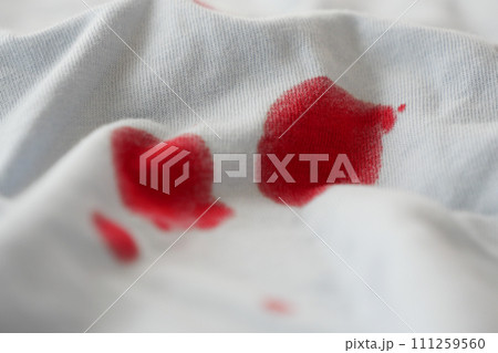 blood stains on a white shirt. 111259560