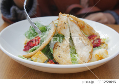 Caesar Salad in a bowl on table, Caesar Salad in a bowl on table, 111259643