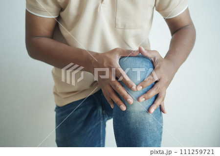 Close up on man suffering knee joint pain 111259721