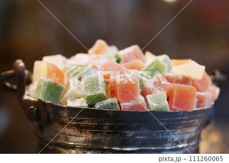turkish delight or lokum of red, green, orange and yellow colors. turkish delight or lokum of red, green, orange and yellow colors. 111260065