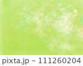 淡いグリーン系に光のボケ入り背景素材 111260204