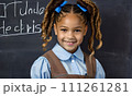 AI-generated content. little girl portrait smile, face little schoolgirl, little student educational institution, 7 years old, child kid girl sitting desk smile, team work, friends classmates, work 111261281
