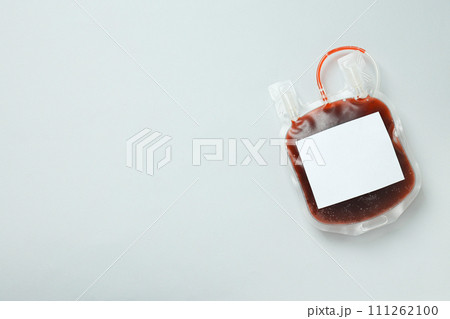 Bag with donor blood on white background, space for text 111262100