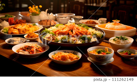 Set of Chinese food on wooden dining table in a restaurant, various snacks, pastries 111262149