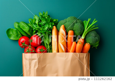 Craft brown shopping paper bag and grocery on blue background. Delivery concept 111262162