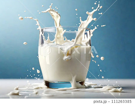 milk splashing out of glass 111263385