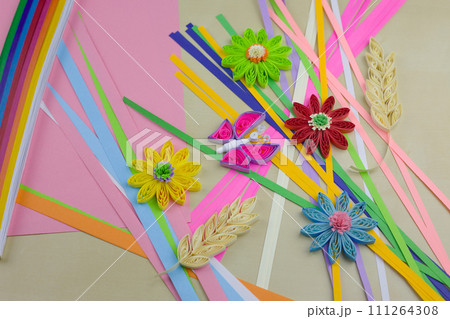 Flowers quilling technique. Elements for decoration made of paper on the table. Hobbies at home to develop fine motor skills 111264308