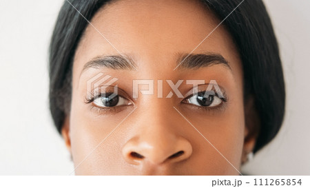 Eyes health. Vision correction. Sight clinic. Ophthalmology services. Young beautiful calm woman face portrait isolated on white background. 111265854