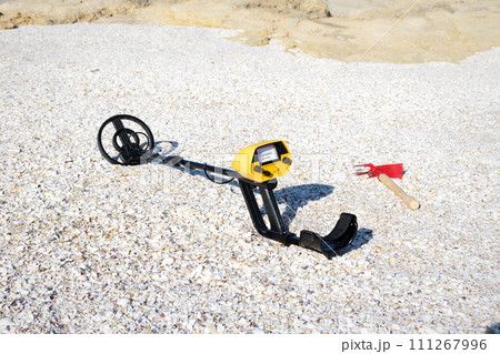 Metal detector on the beach. Metal detector on the beach. 111267996