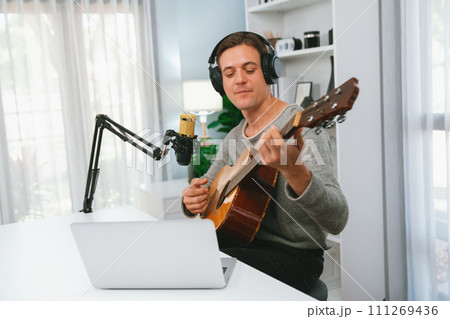 Singer with smile face on social media, playing guitar along singing. Pecuniary. Singer with smile face on social media, playing guitar along singing. Pecuniary. 111269436