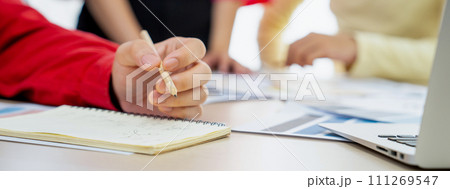 Skilled designer team discussing while project manager taking a note. Variegated 111269547