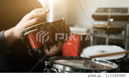 Musician playing hand drum Musician playing hand drum 111269990