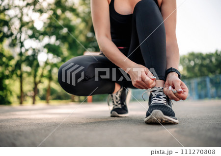 Woman exercising outdoors Woman exercising outdoors 111270808