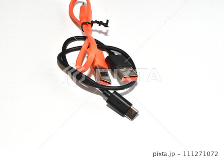 Two USB cables are lying on the table. Two USB cables are lying on the table. 111271072