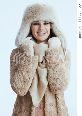 happy woman in winter coat and fur hat on white happy woman in winter coat and fur hat on white 111271122