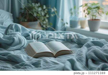 book stand and book on bed, 111271169