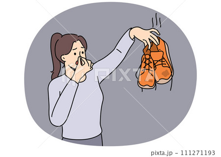 Woman cover nose disgusted with smelly shoes 111271193