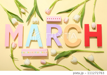 The inscription March in colorful letters with tulips The inscription March in colorful letters with tulips 111272763