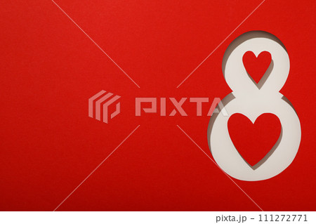 Number eight cut out of paper on a red background Number eight cut out of paper on a red background 111272771