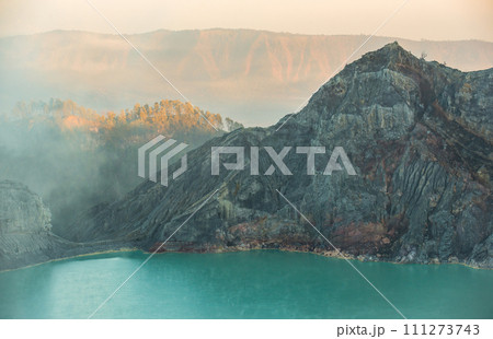 Acid lake view from crater of Kawah Ijen volcano in Java island, Indonesia at dawn. 111273743