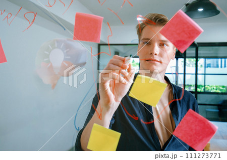 Businessman writing idea by using mind map and sticky notes. Immaculate. Businessman writing idea by using mind map and sticky notes. Immaculate. 111273771