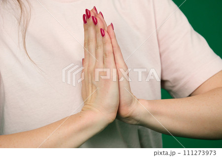 beautiful woman hands isolated body parts of a young woman on a green background chromakey 111273973