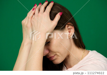 Young beautiful arab woman wearing winter sweater over isolated background suffering from headache desperate and stressed because pain and migraine. Hands on head. 111274022