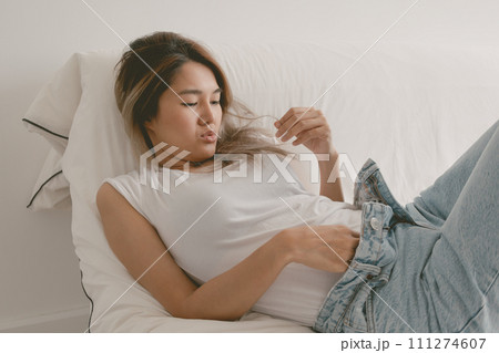 Beautiful attractive single woman enjoy being alone with herself. Beautiful attractive single woman enjoy being alone with herself. 111274607