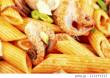 Greek food, octopus and macaroni. 111275157