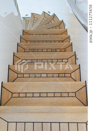 Teak wood deck ladder. Wooden deck on super yacht. Yachting concept. 111275656