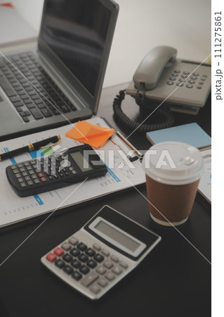 Business team meeting working with new startup project, discussion and analysis data the charts and graphs. Digital tablet, calculator, laptop computer using, Business finance and accounting concept. Business team meeting working with new startup project, discussion and analysis data the charts and graphs. Digital tablet, calculator, laptop computer using, Business finance and accounting concept. 111275861