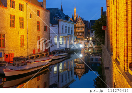 Cityscape with the picturesque night canal Dijver in Bruges 111276413