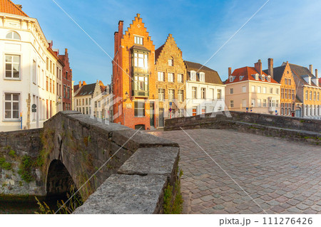 Bruges canal and bridge at sunset, Belgium Bruges canal and bridge at sunset, Belgium 111276426
