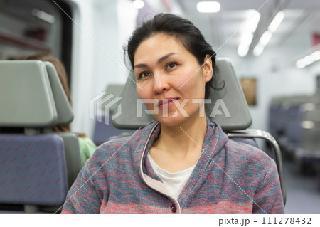 Portrait of woman traveling in urban trai Portrait of woman traveling in urban trai 111278432