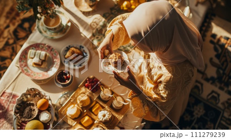 Muslim Woman eating iftar in Ramadan. Celebration Ramadan. 111279239