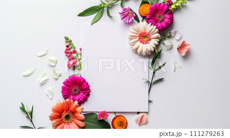 Floral pattern on a white background with a white blank card. Layout, top view. 111279263