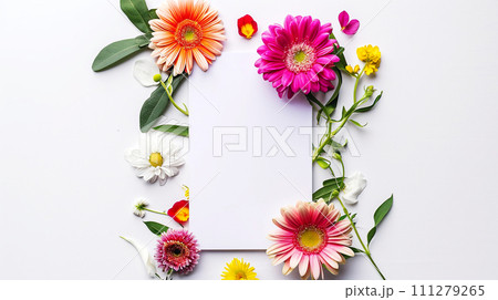 White blank greeting card on the white background with colorful flowers. White blank greeting card on the white background with colorful flowers. 111279265