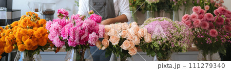 Five bouquets of flowers on the blurred background of a flower shop. Five bouquets of flowers on the blurred background of a flower shop. 111279340