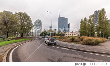 Panorama showing skyscrapers and towers from park with green lawn timelapse in Milan Panorama showing skyscrapers and towers from park with green lawn timelapse in Milan 111280703