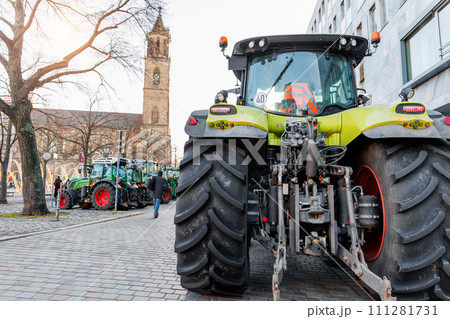Farmers union protest strike against government Policy in Germany Europe. Tractors vehicles blocks city road traffic. Agriculture farm machines Magdeburg central Domplatz square 111281731