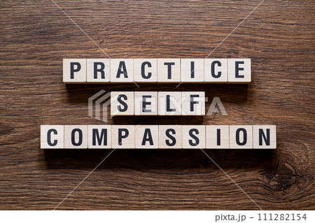 Practice self compassion - word concept on building blocks, text Practice self compassion - word concept on building blocks, text 111282154