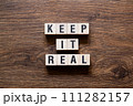 Keep it real - word concept on building blocks, text 111282157