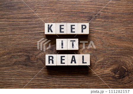 Keep it real - word concept on building blocks, text 111282157
