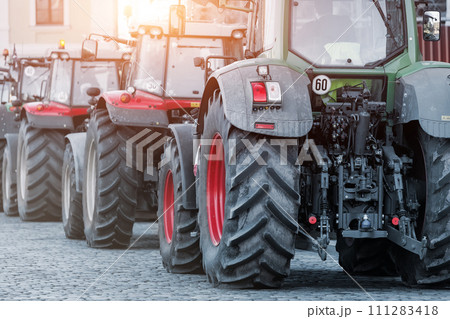 Farmers union protest strike against government Policy in Germany Europe. Tractors vehicles blocks city road traffic. Agriculture farm machines Magdeburg central Domplatz square Farmers union protest strike against government Policy in Germany Europe. Tractors vehicles blocks city road traffic. Agriculture farm machines Magdeburg central Domplatz square 111283418