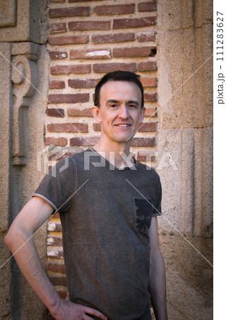 Jovial man in positive and calm attitude Jovial man in positive and calm attitude 111283627