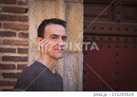 Jovial man in positive and calm attitude 111283628