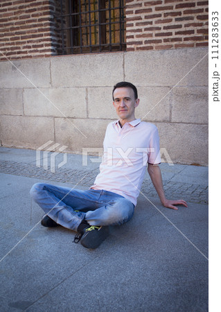 Jovial man in positive and calm attitude 111283633