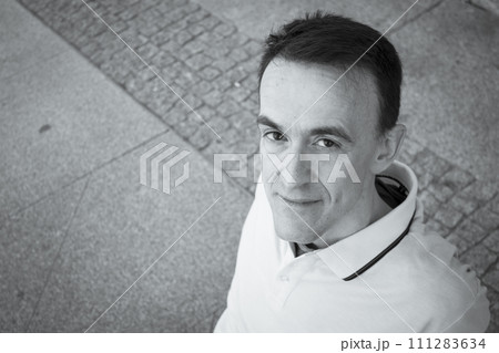 Jovial man in positive and calm attitude 111283634